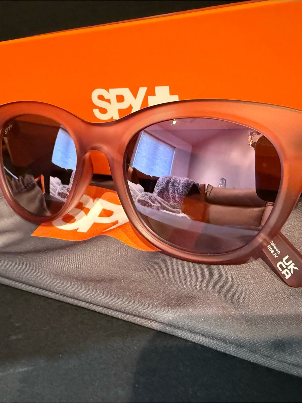 SPY Women's Round Sunglasses in Translucent Rose Pink